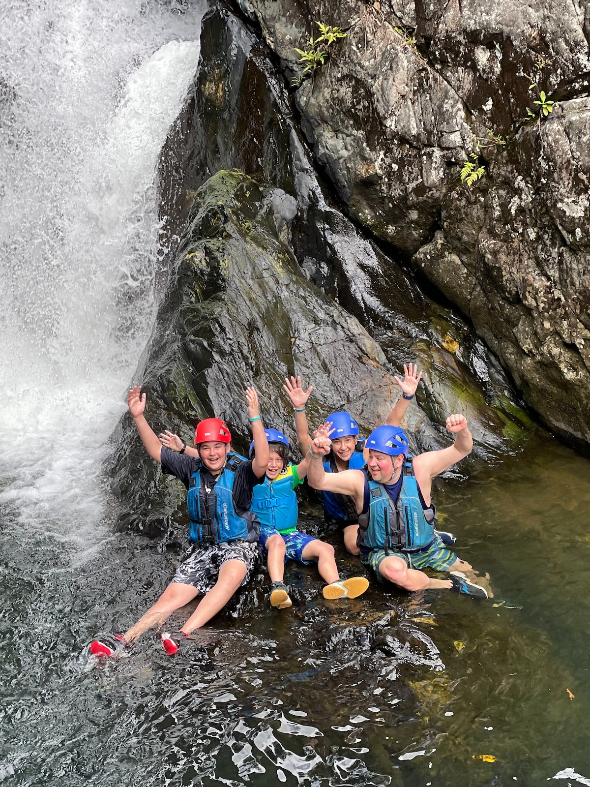 Explore natural water slides with safety gear