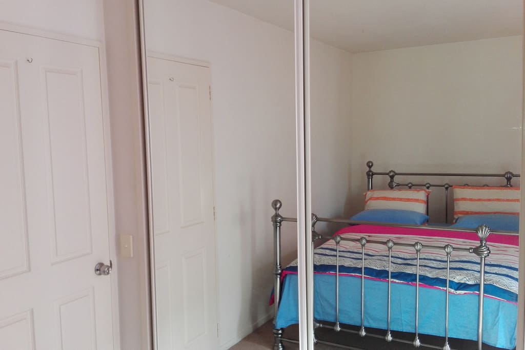 Full size mirrors and spacious wardrobes behind.