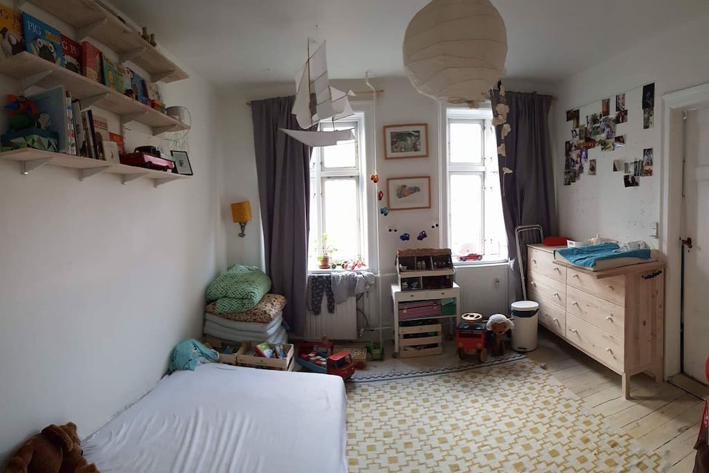 Kids room: queen size (120cm) box mattress, changing table and lots of toys + books