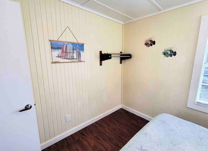 The bedroom has clothes storage.