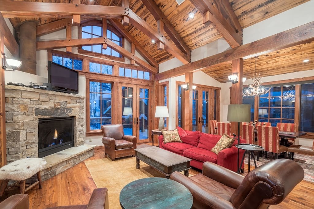 Vaulted ceilings and tall picture windows provide a grand yet cozy living area