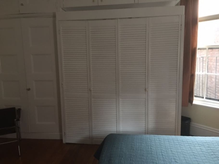 Kitchenette is behind the louvered doors. The two doors, on the left, are to the closet.