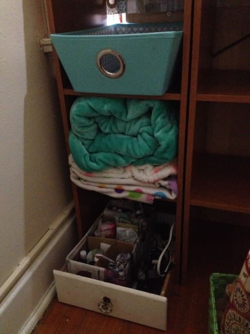 Adjacent to the desk, we have toiletries and extra amenities.