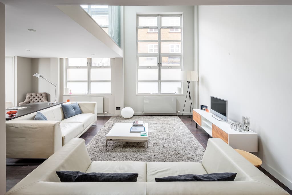 My striking living area is modern with huge windows.