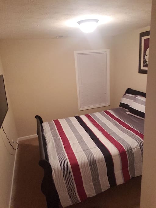 the second bedroom with a queen size bed 42 inch plasma TV