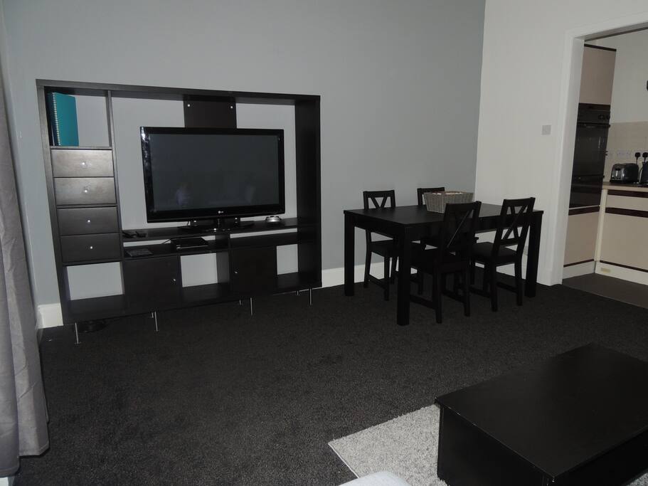 Dining area next to small kitchen