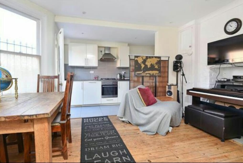open plan kitchen/laundry room hidden behind kithen +wireless pc & music studio with piano +32"screen