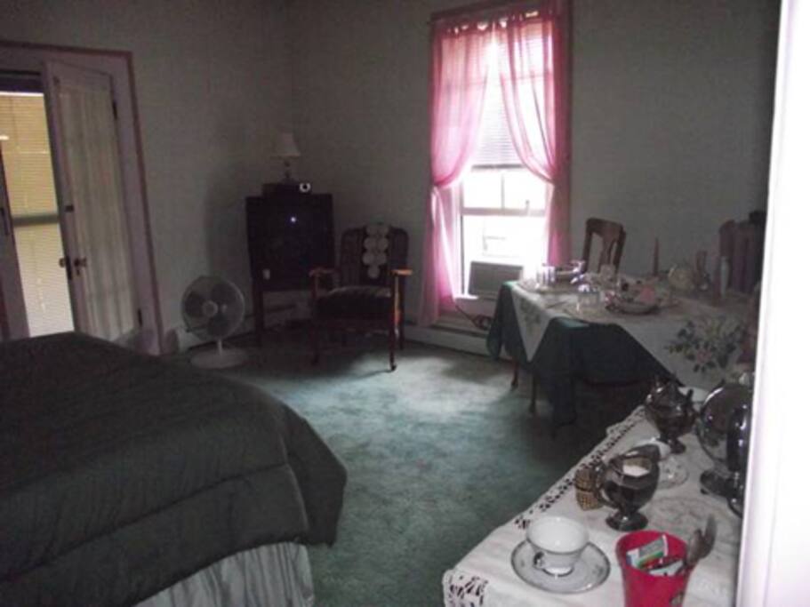 Second floor guest room with private bath..door leading to veranda