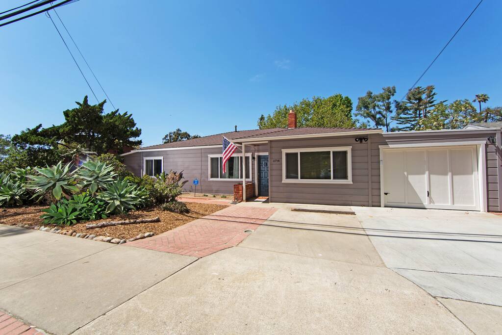 Front of the house with driveway for two cars.