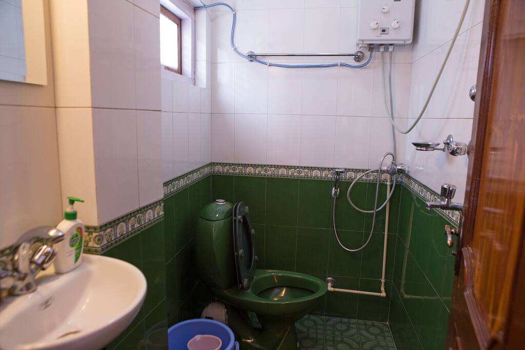 Toilet with hot shower.