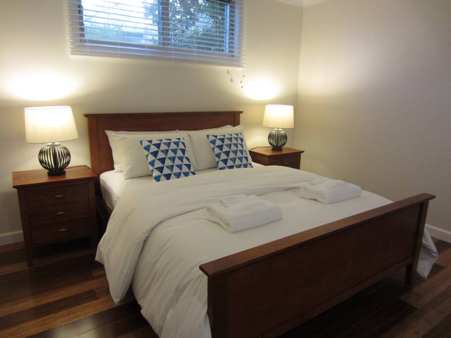 Main queen sized bed (in open lounge/dining)