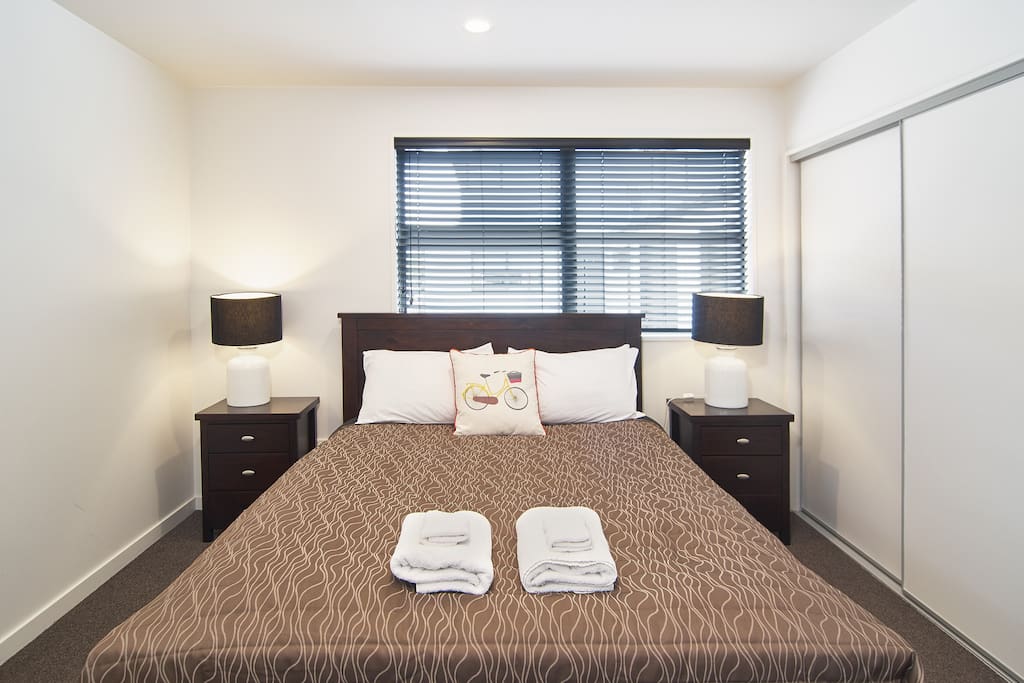 The downstairs master bedroom with ensuite and wardrobe