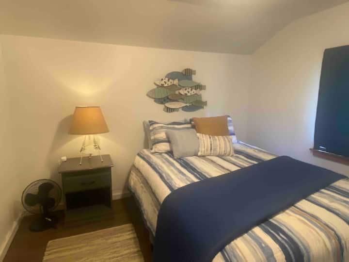 Bedroom on main level with queen bed.