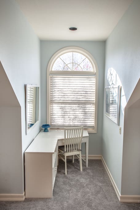 Large desk with storage and closet to right
