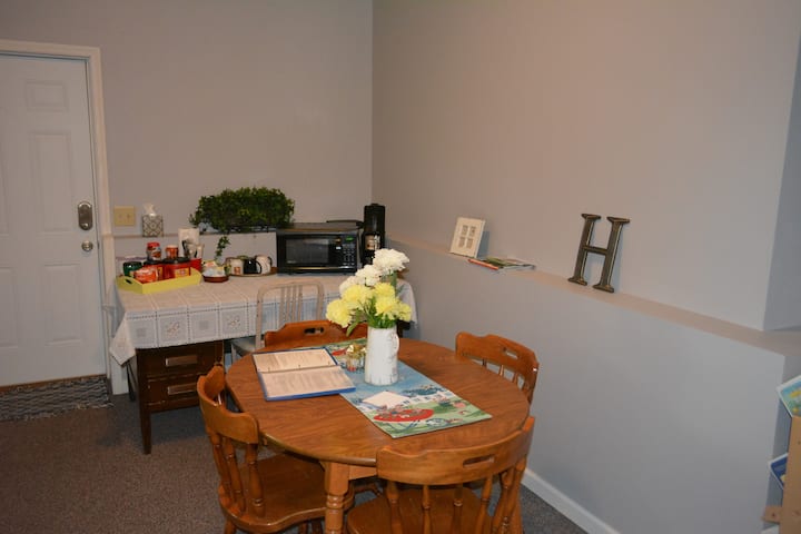 Entry area. Coffee maker, Microwave,  work table.