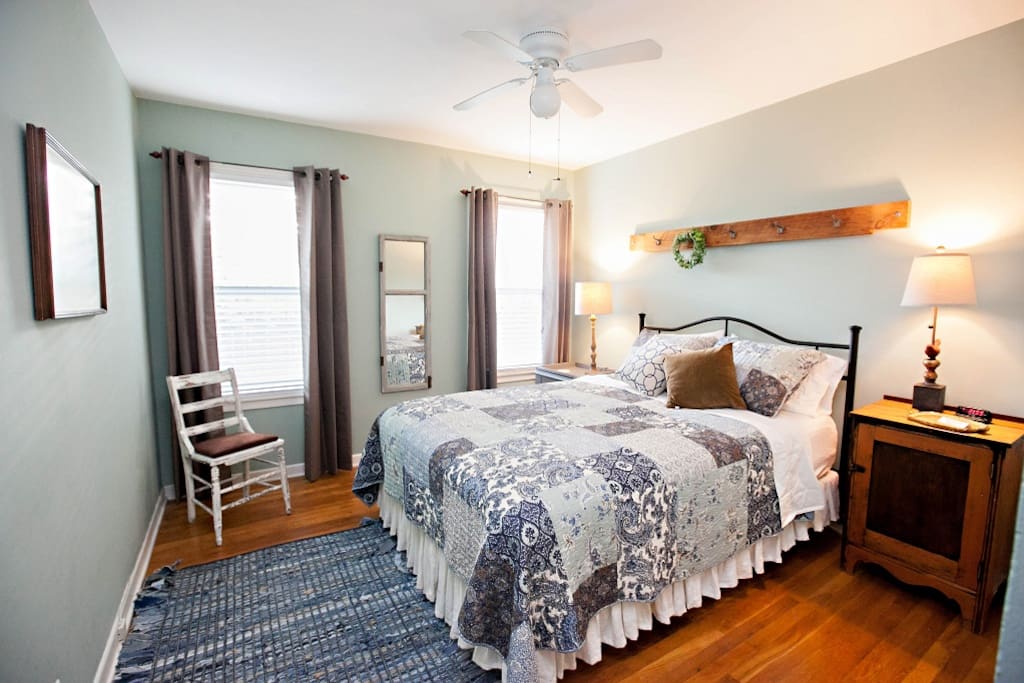 1st bedroom featuring a queen bed