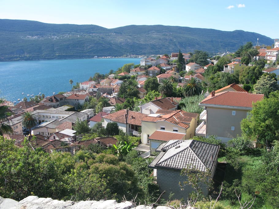 See the yellow gable wall with small window towards the top right of the photo