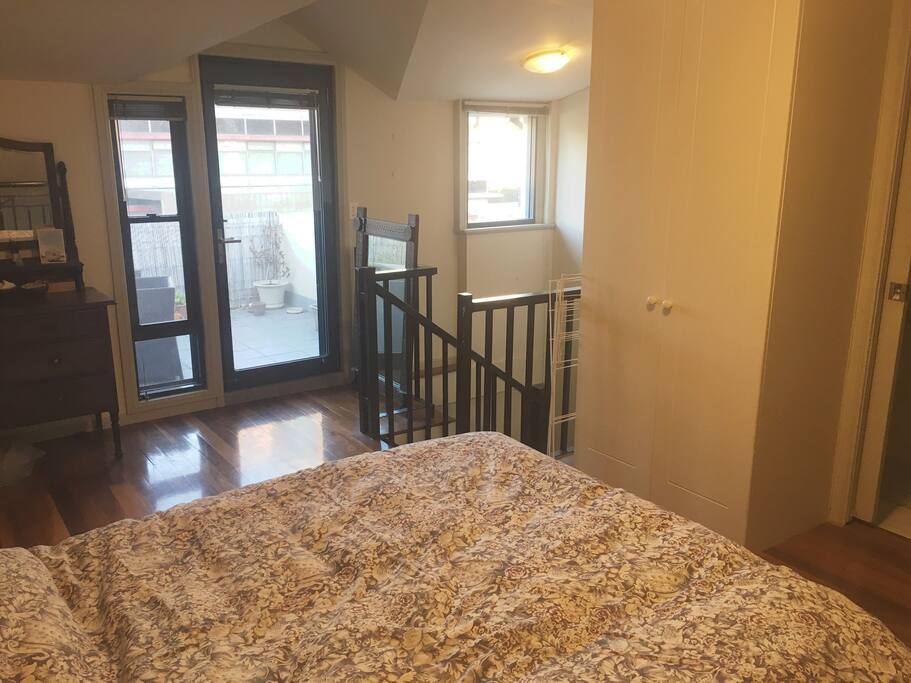 master bedroom with ensuite and access to roof terrace