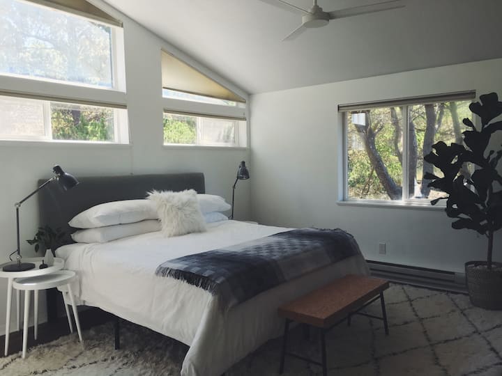 The light and airy primary bedroom is privately located on the opposite side of the house from the other two bedrooms. All three bedrooms feature king beds.