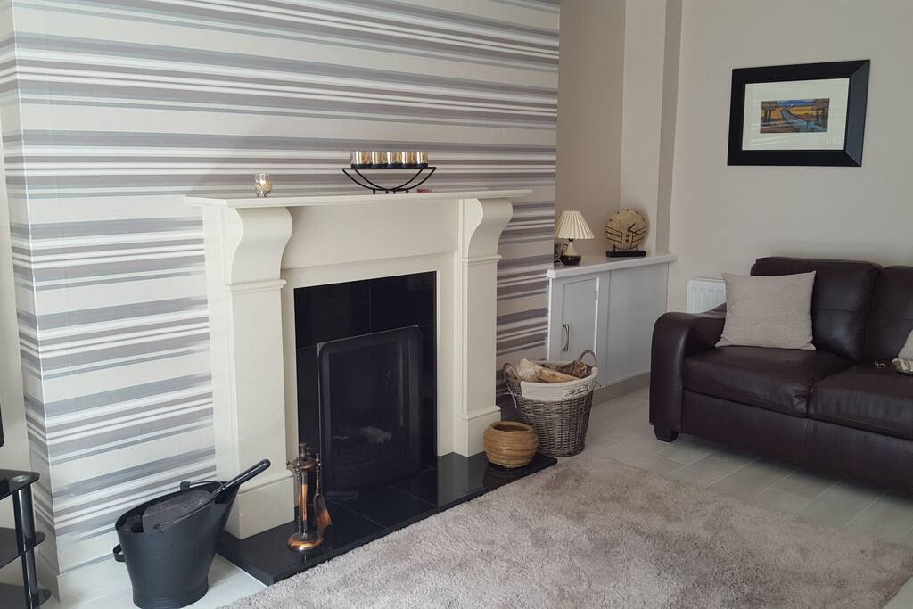 Main lounge with open fire or oil central heating.