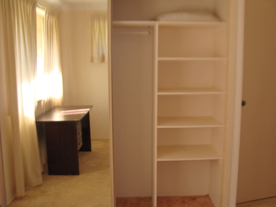 Double mirror build in wardrobe with hangers and shelves