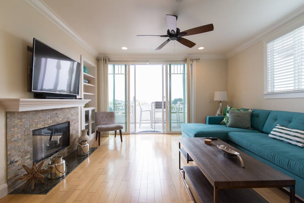 Living room features fireplace and smart tv