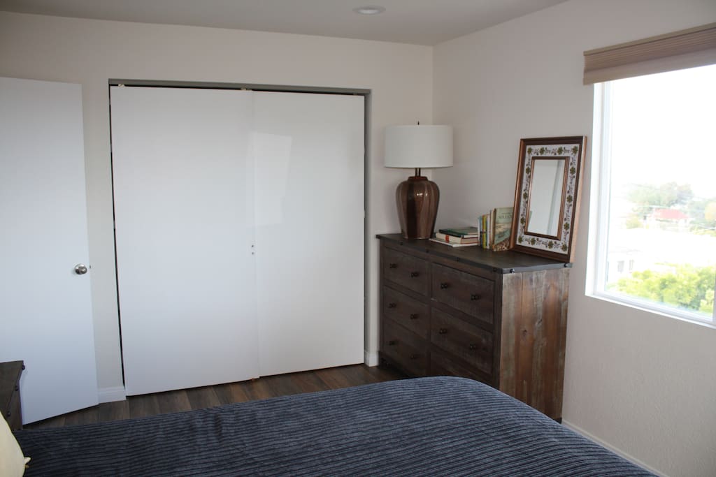 closet and chest of drawers in master bedroom.