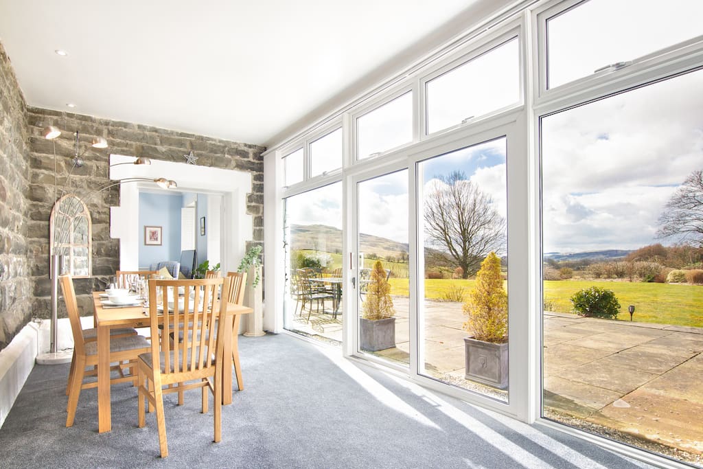 Conservatory and dining area opens out directly onto the patio and gardens