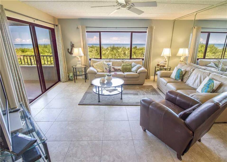 Welcome to this bright, airy, well-furnished ocean-view condo! - There's room for everyone to gather in the living room for games