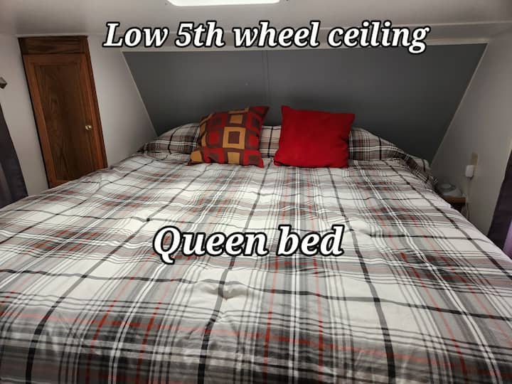 Queen bedroom with privacy curtain 