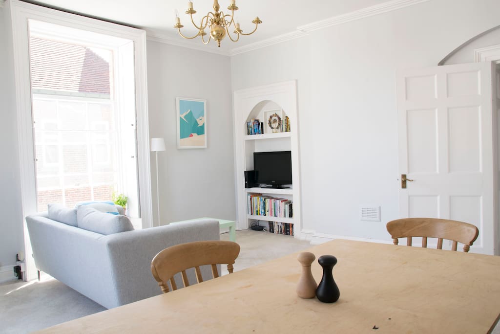 Our lovely light and airy living room with dining table