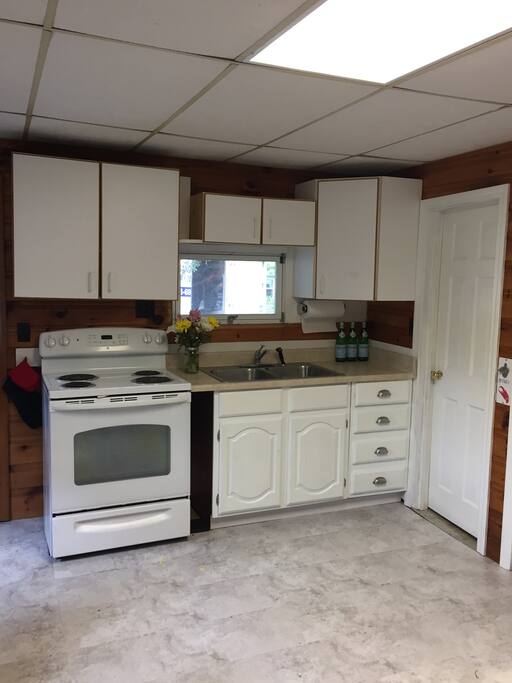 Kitchen with full sized oven.