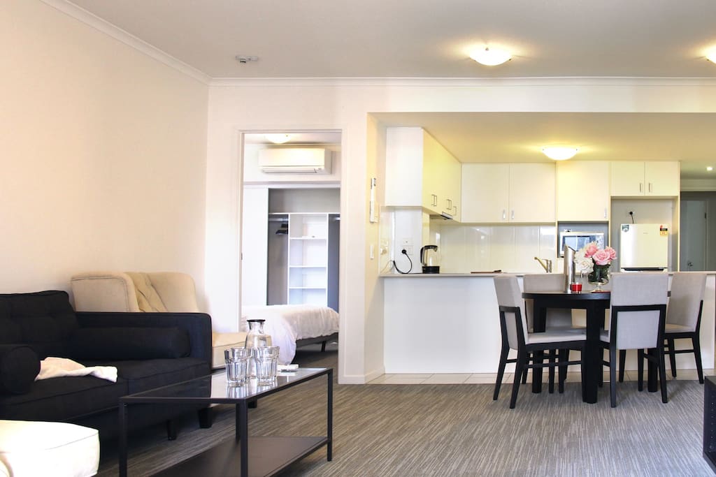 Open and spacious living & dining area with a private bedroom.