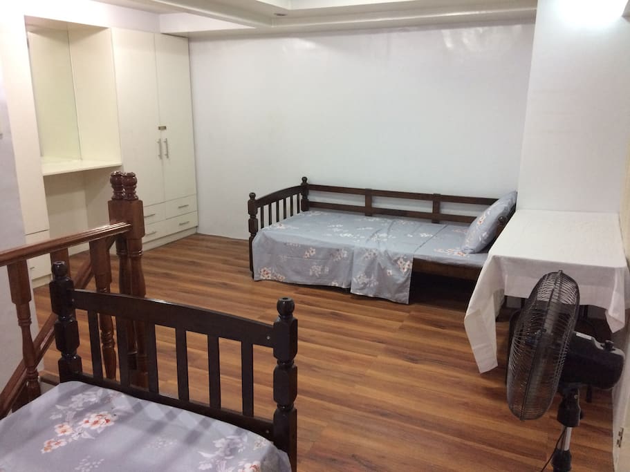 Two beds and table with chairs