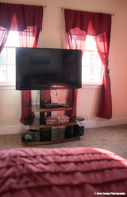 Watch your favorite movies from Hulu, Netflix, and DVD's on a 50 inch Smart TV. Change channels from the comfort of your bed.