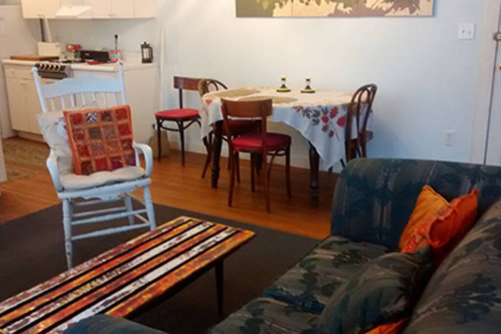 Looking toward dining area and kitchen from seating area