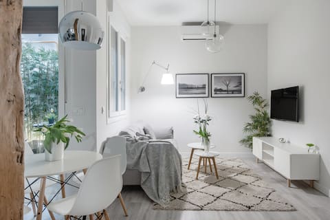 Stroll to la Concha beach from this new designer apartment with patio