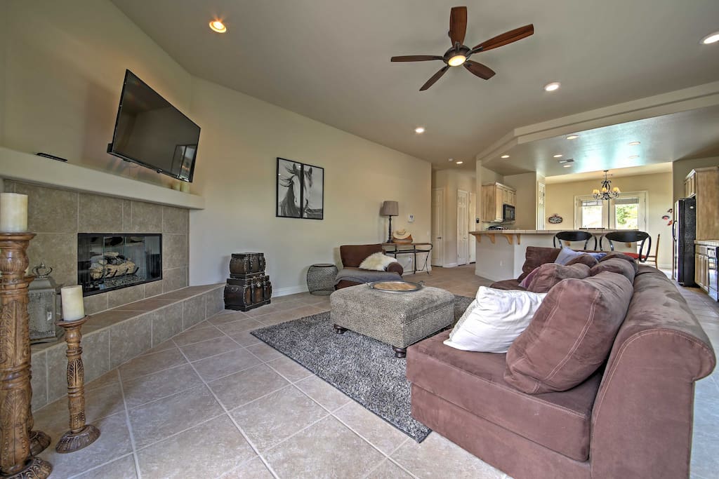 Relax in the open-concept living space, boasting high ceilings throughout the home.