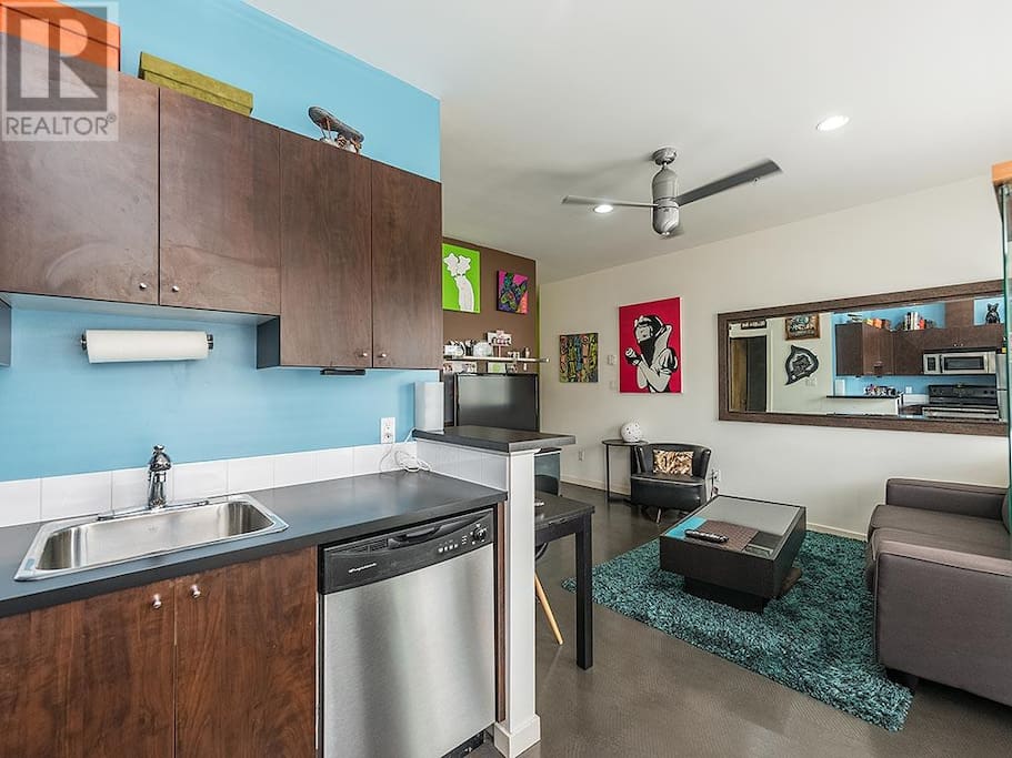 Stainless steel appliances. And the large wall mirror looks great!