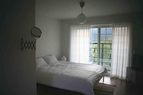 Stay Mureung Paradise Room B, a country house with a dense forest and a river