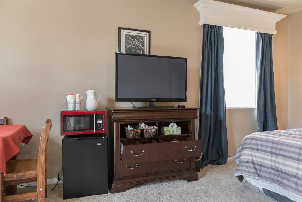 tv, microwave, fridge, breakfast supplies