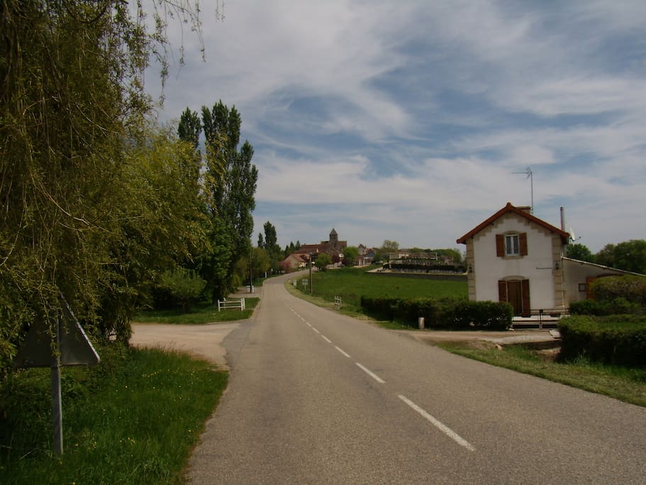 the road in front of the house, leading to the village