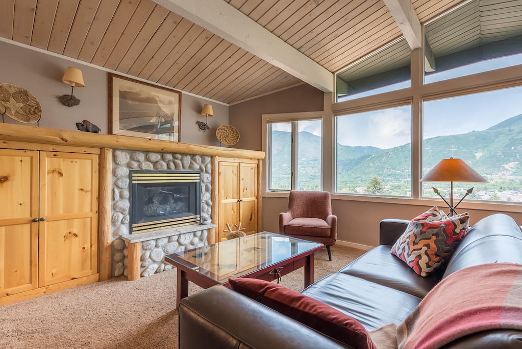 Gas fireplace, TV, DVD player and games are located in cabinets next to fireplace.