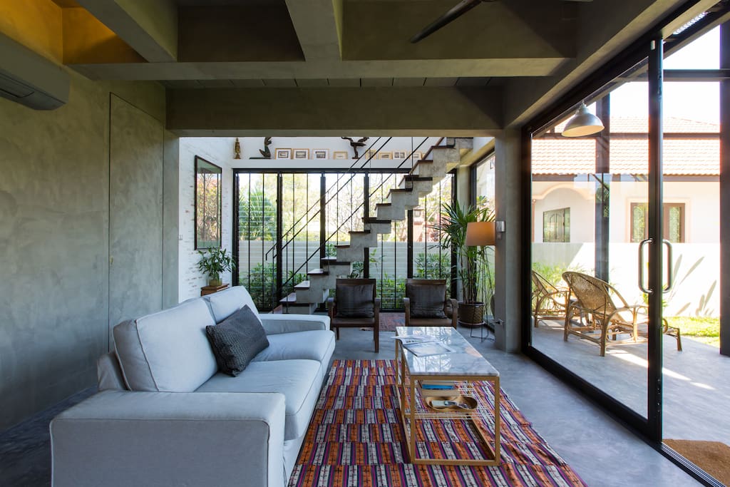 The lazy sofa overlooks the terrace and the garden beyond.
