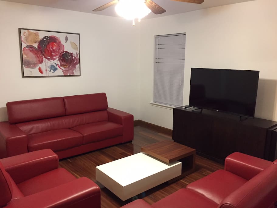 Family room - leather furniture and 50" screen TV