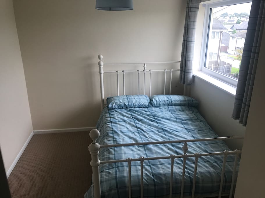 Bedroom lacking in cluttery furniture. Or homely feel.