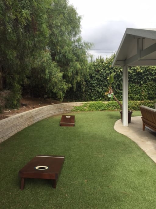 Use of cornhole game with room to roam.