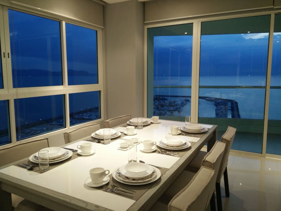 View of ocean and marina from living room and dining room. A beautiful sight.