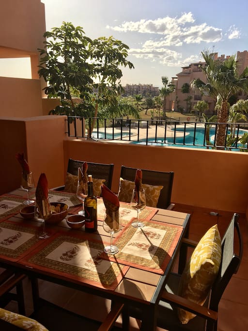 Dine out on the terrace overlooking the pool