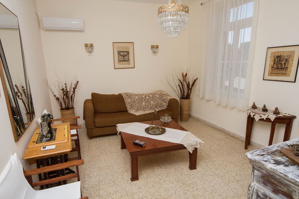 The living room is decorated with antique furnitures and traditional Rhodian pieces.